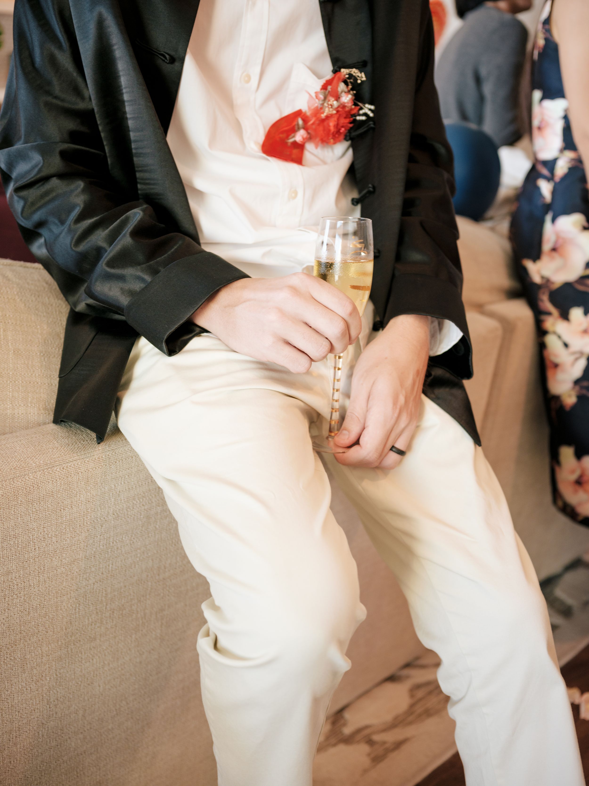 Detail shots of formal wedding attire including black jackets and khaki pants at indoor reception.