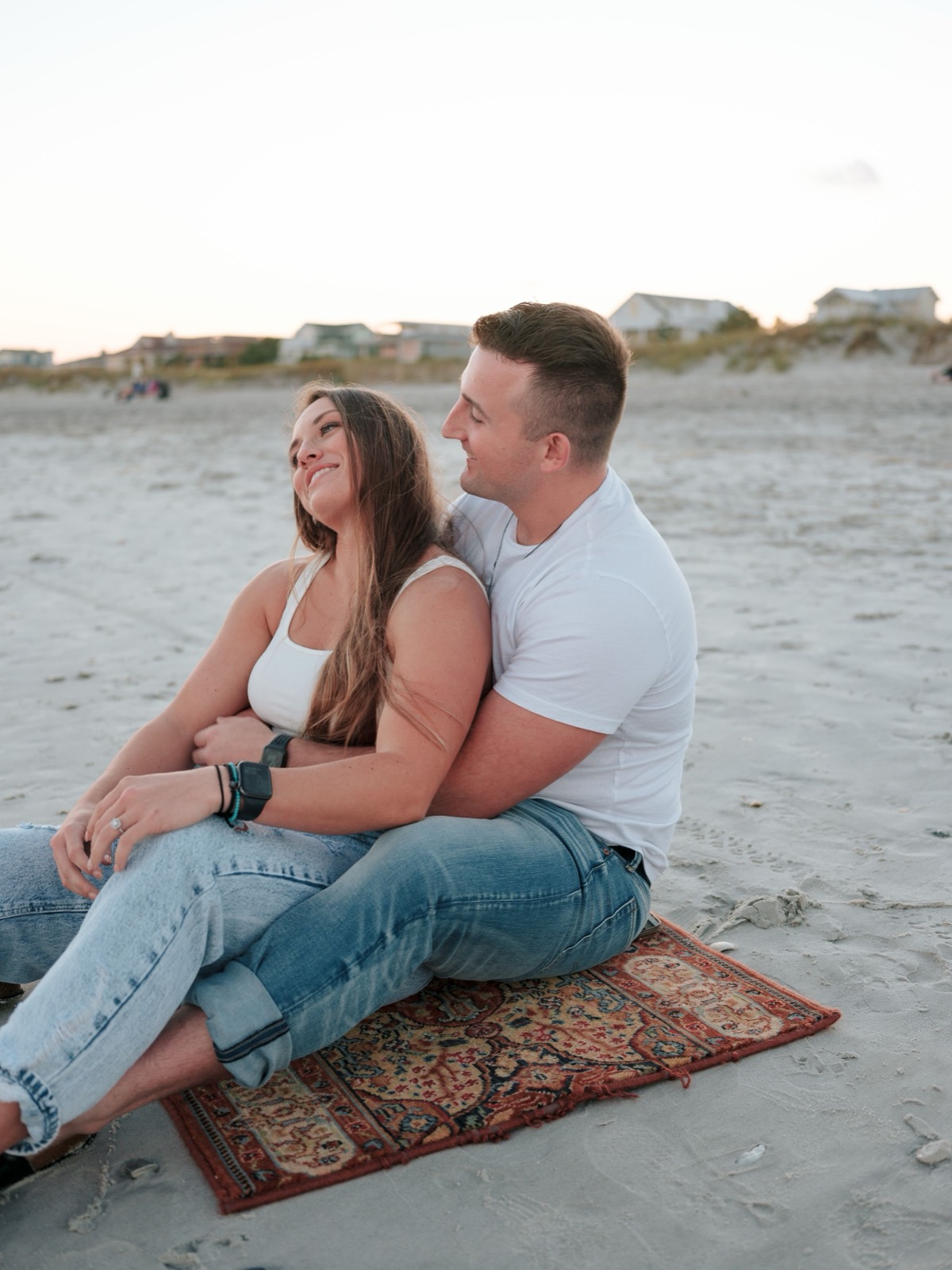 couple sitting down at the beach
