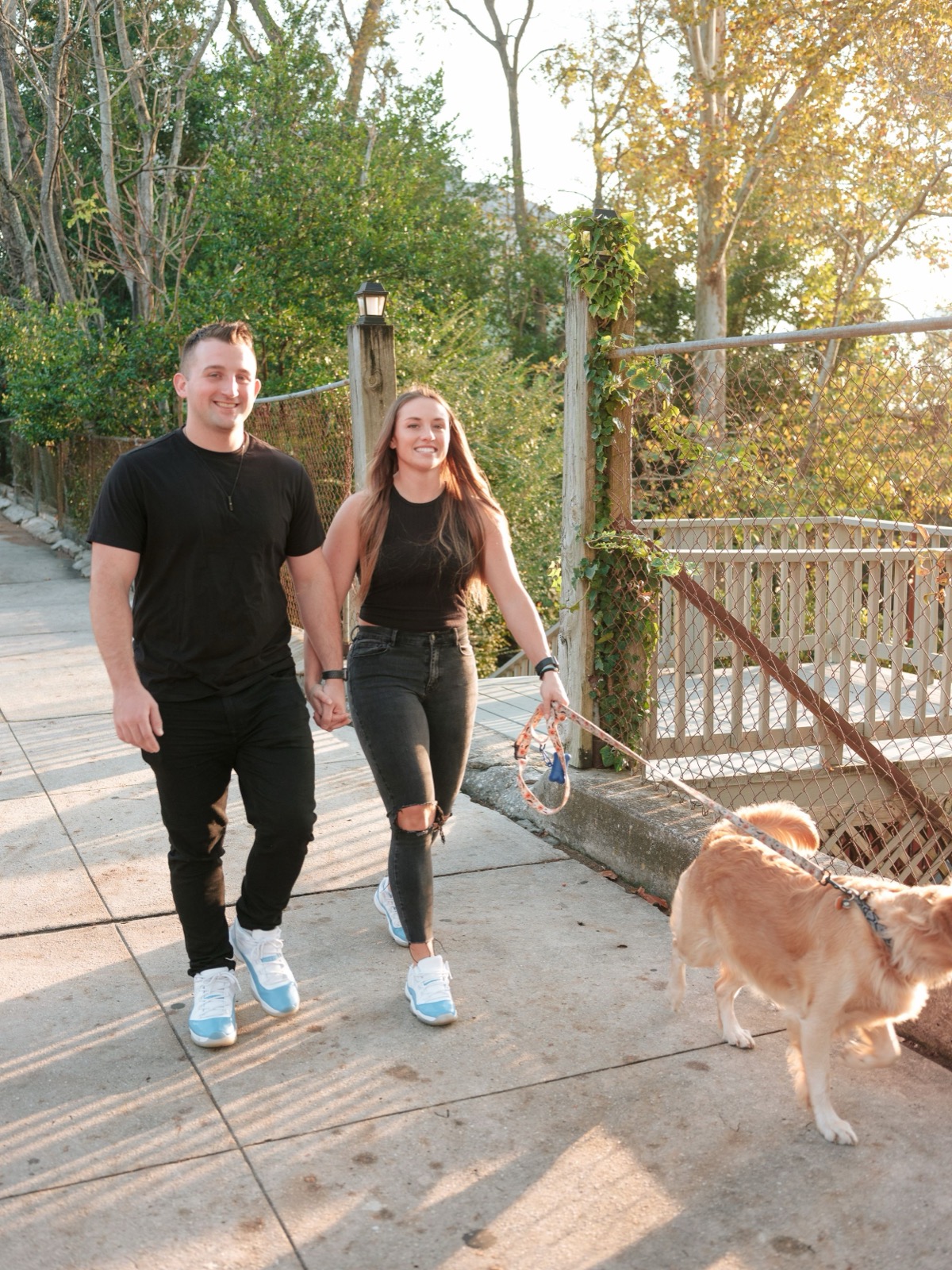 couple walking with their dog in dc