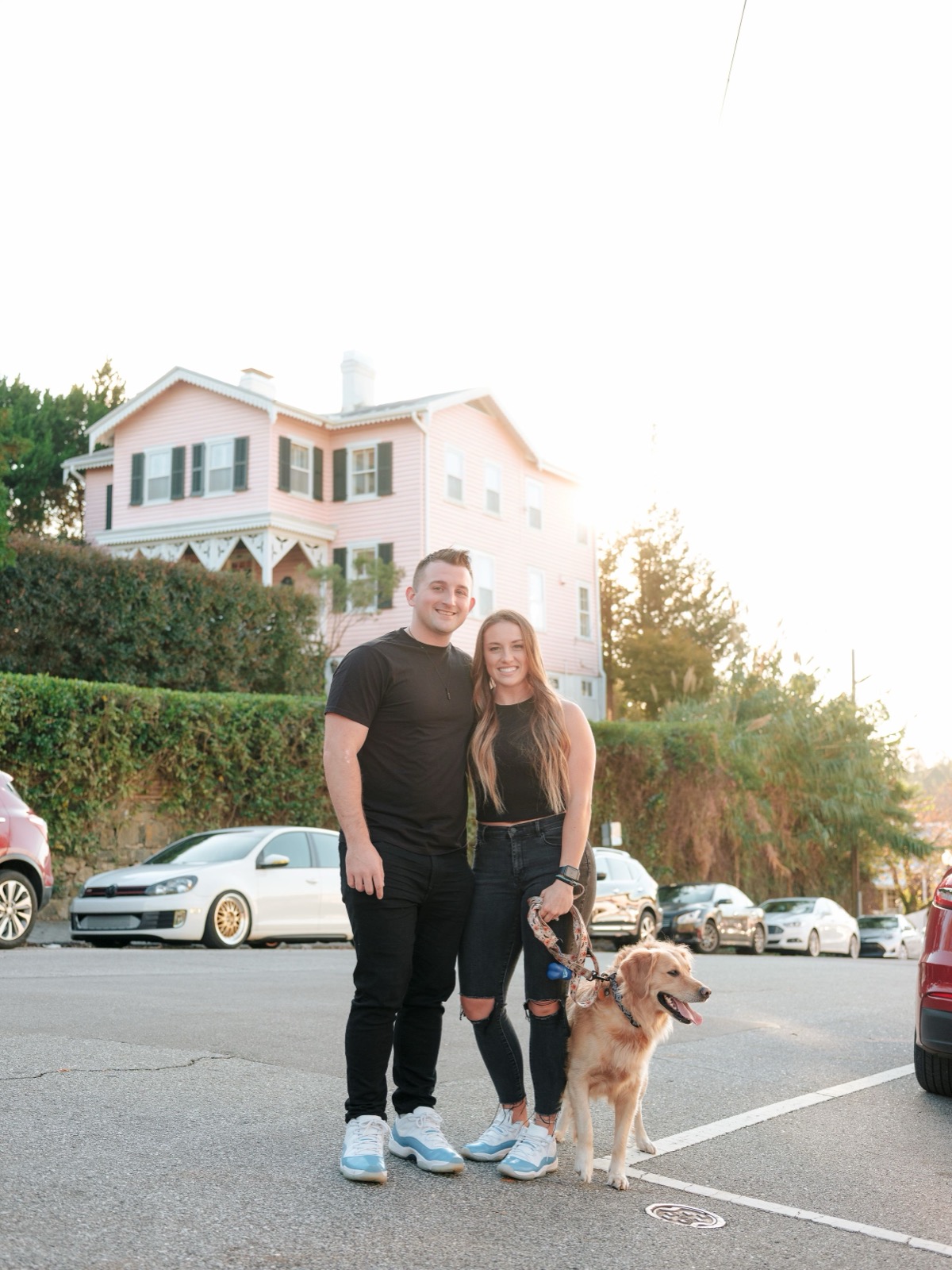 couple holding dog for their engagement sesion