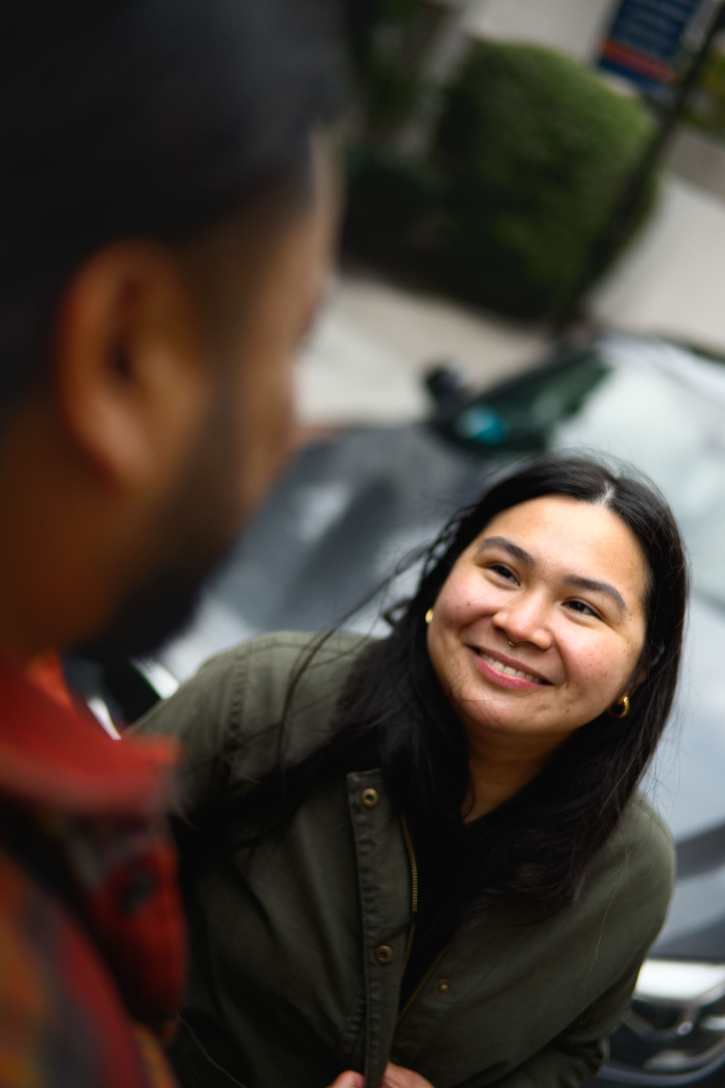 Close-up candid shots showing joyful expressions and genuine laughter in an outdoor setting.