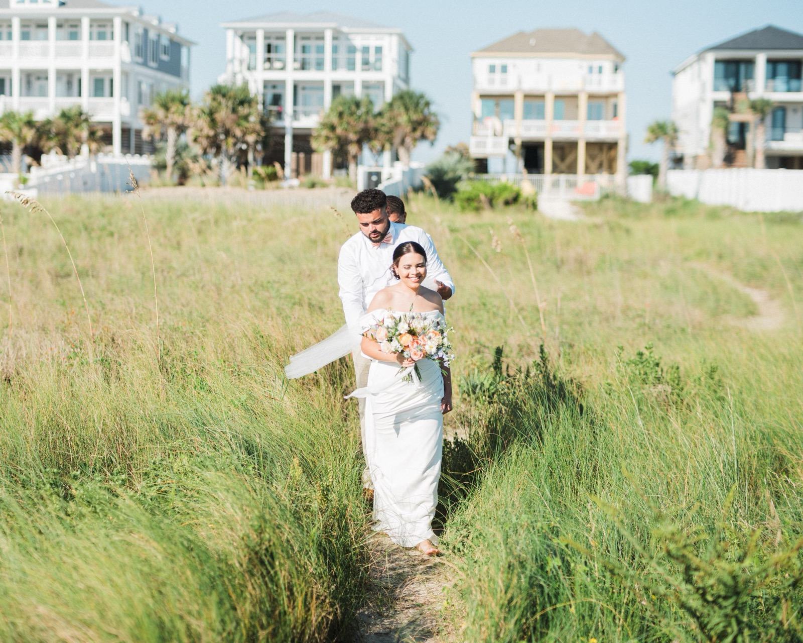 Beach Wedding In Oak Island + Beach House and Reception Photos — photograph 11