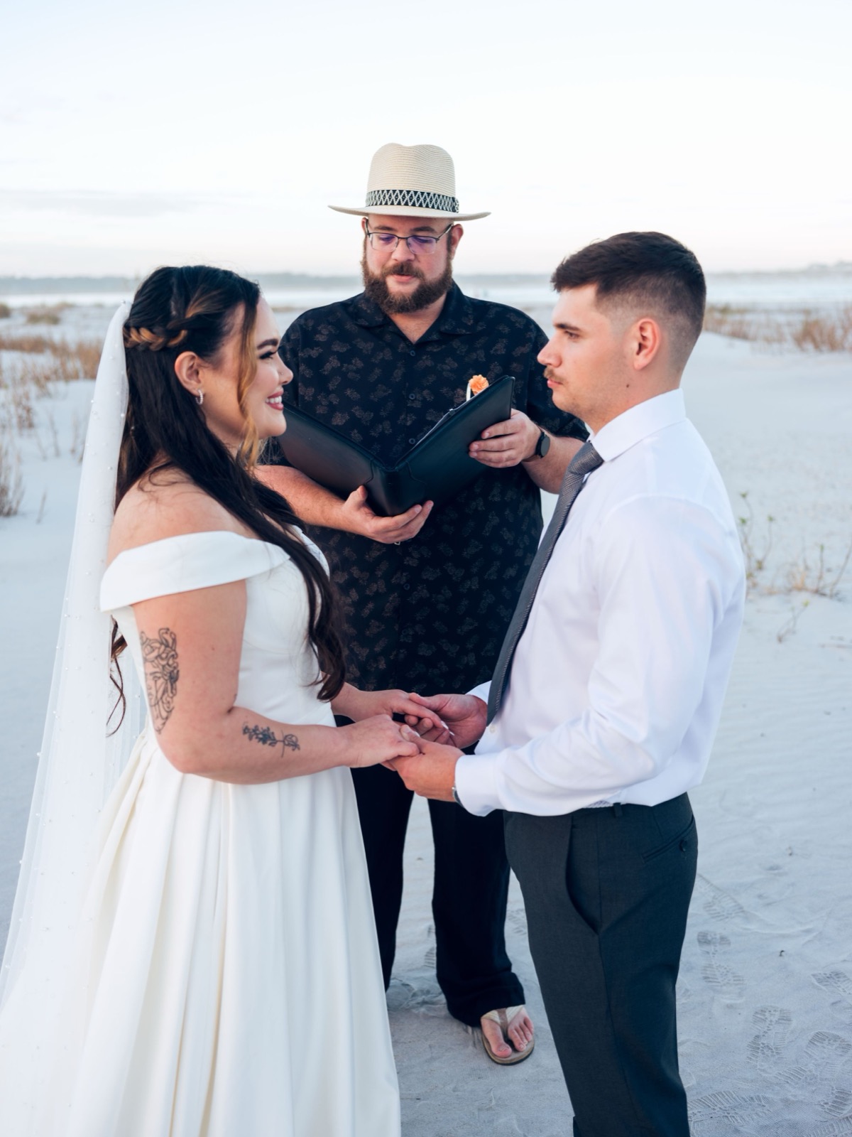 couples at the beach doing their ceremony