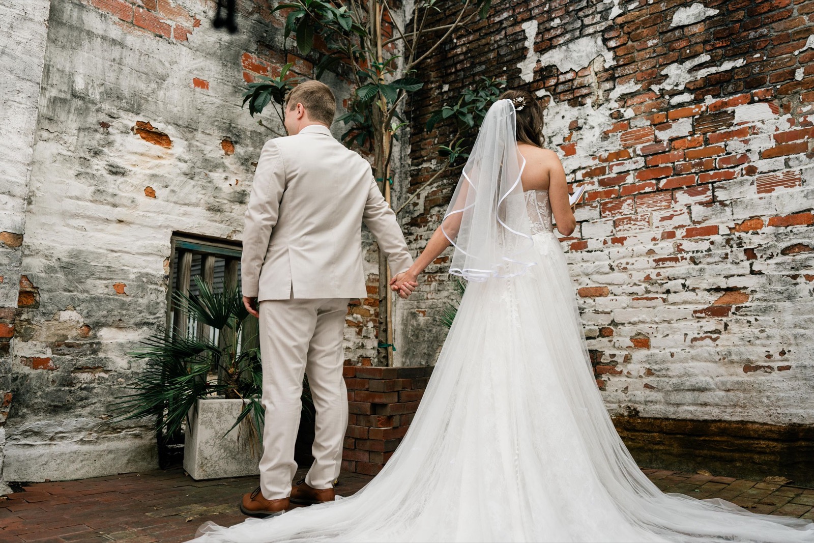 couples getting married at an outdoor wedding venue at the Atrium in Wilmington, NC