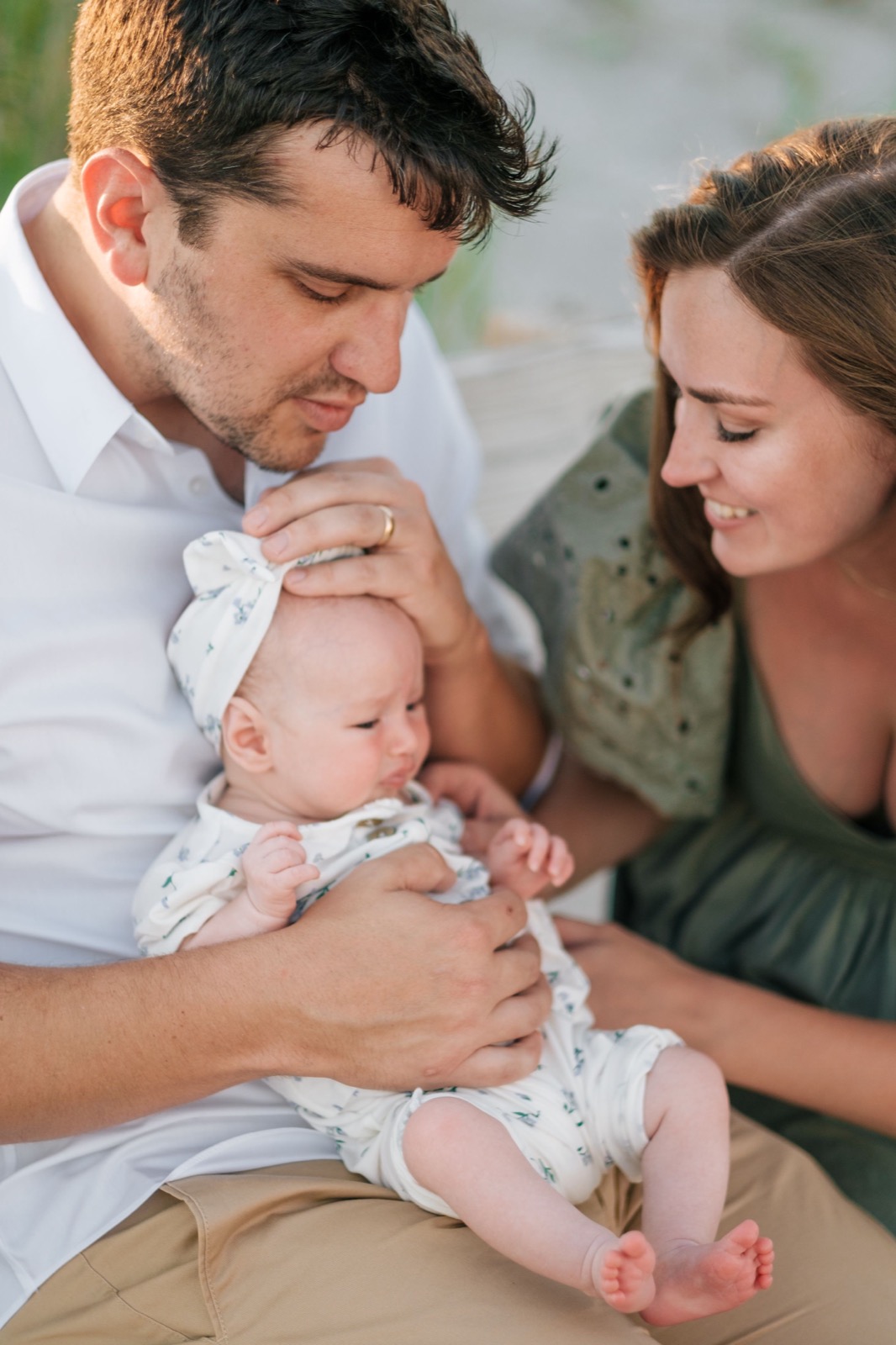 Dad sitting on the bench with the baby on the lap! how to get simple yet memorable family photos | pink penguin studios