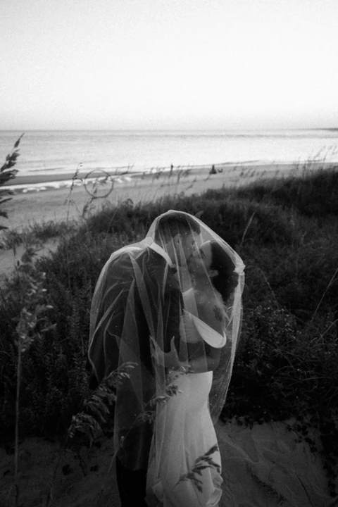 Dana and Ryan sharing a portrait beneath a veil