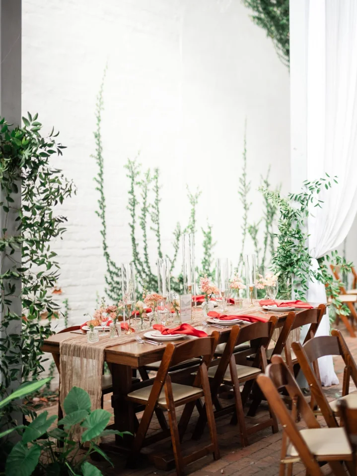 Wedding reception tables set for dinner in a garden